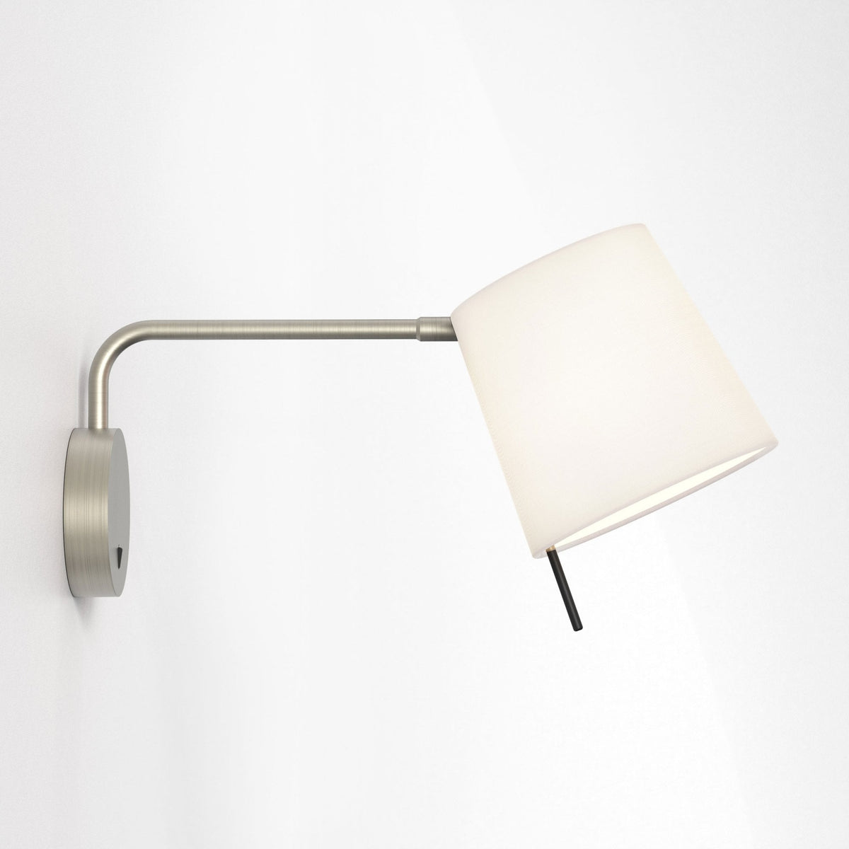 Brushed nickel wall sconce with a white fabric shade