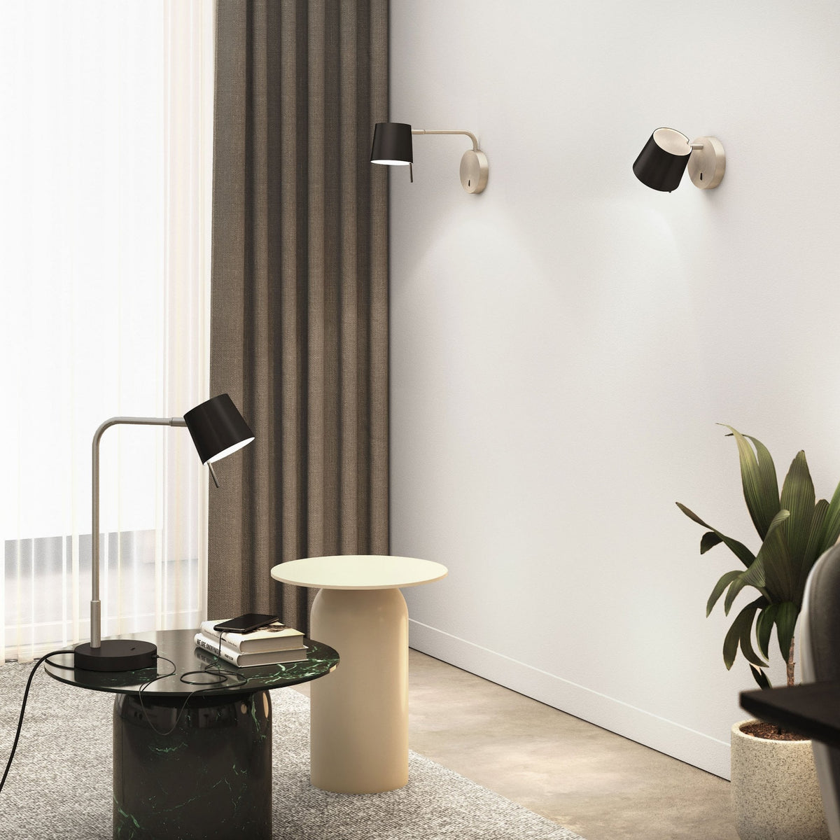 A modern living room with a green marble coffee table, a beige side table, and three black wall lamps