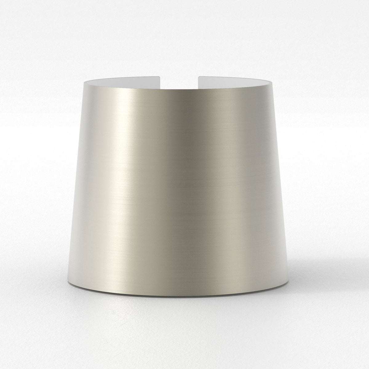 Brushed metal cylindrical object with a slight taper and two cutouts at the top