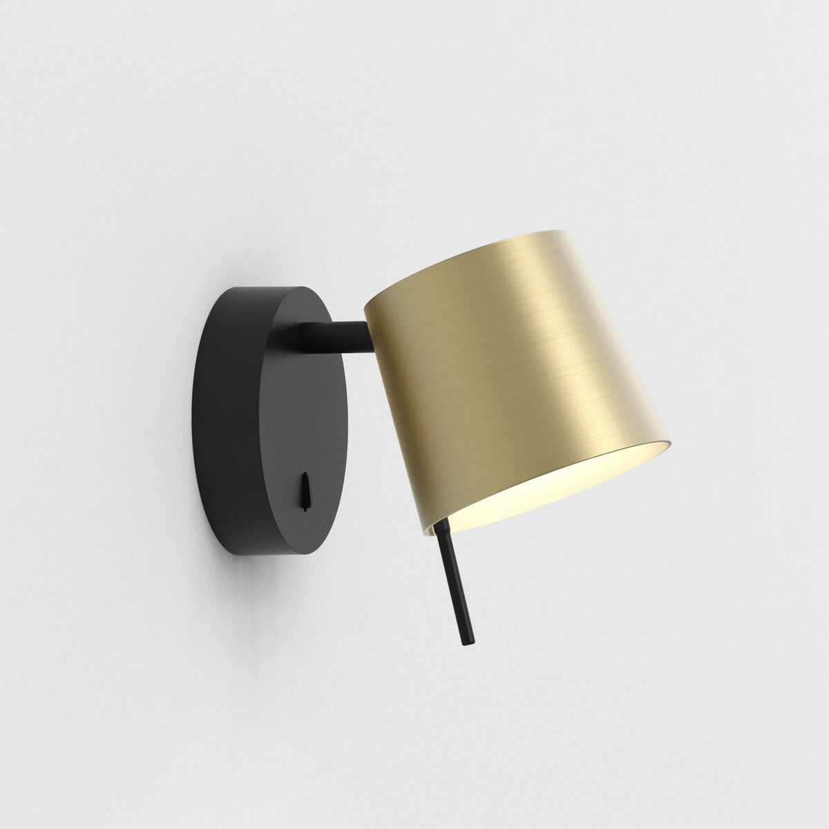 Black and gold wall light with a cylindrical shade