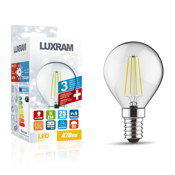A LED filament bulb in its packaging next to the bulb itself. The bulb has an E14 fitting.