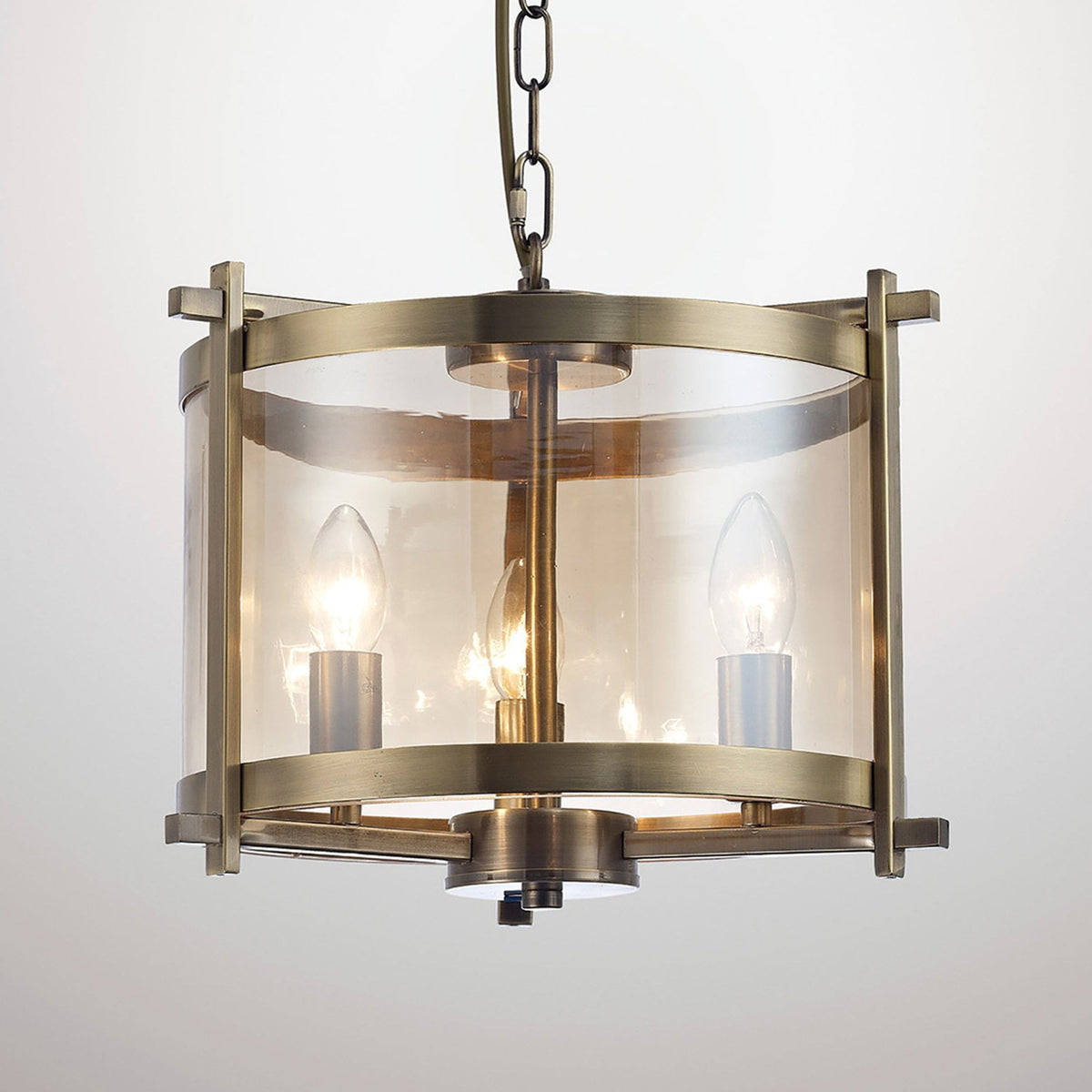 Nolan 3 Light Glass Pendant in Antique Brass with Amber Glass