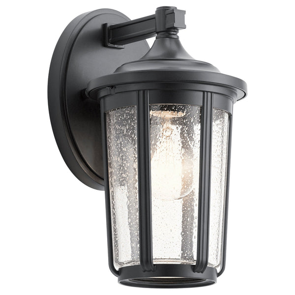 A black outdoor wall lantern with a seeded glass shade and an exposed bulb.