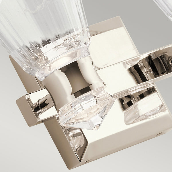 A close up of the clear crystal detail on a two light nickel and crystal wall sconce.