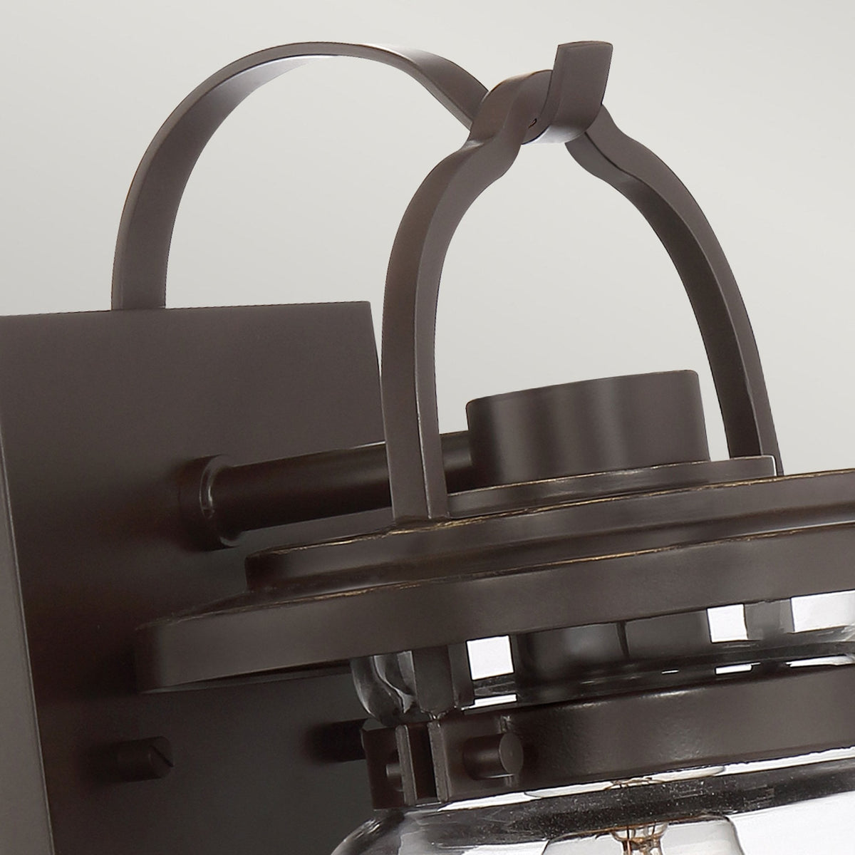 Close-up of the top part of the bronze outdoor wall light.