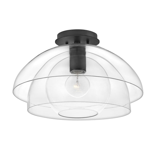 A contemporary black flush-mount ceiling light featuring transparent, stacked dome shades.