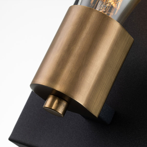 Close-up of the brass bulb holder and bottom detail of the wall light.