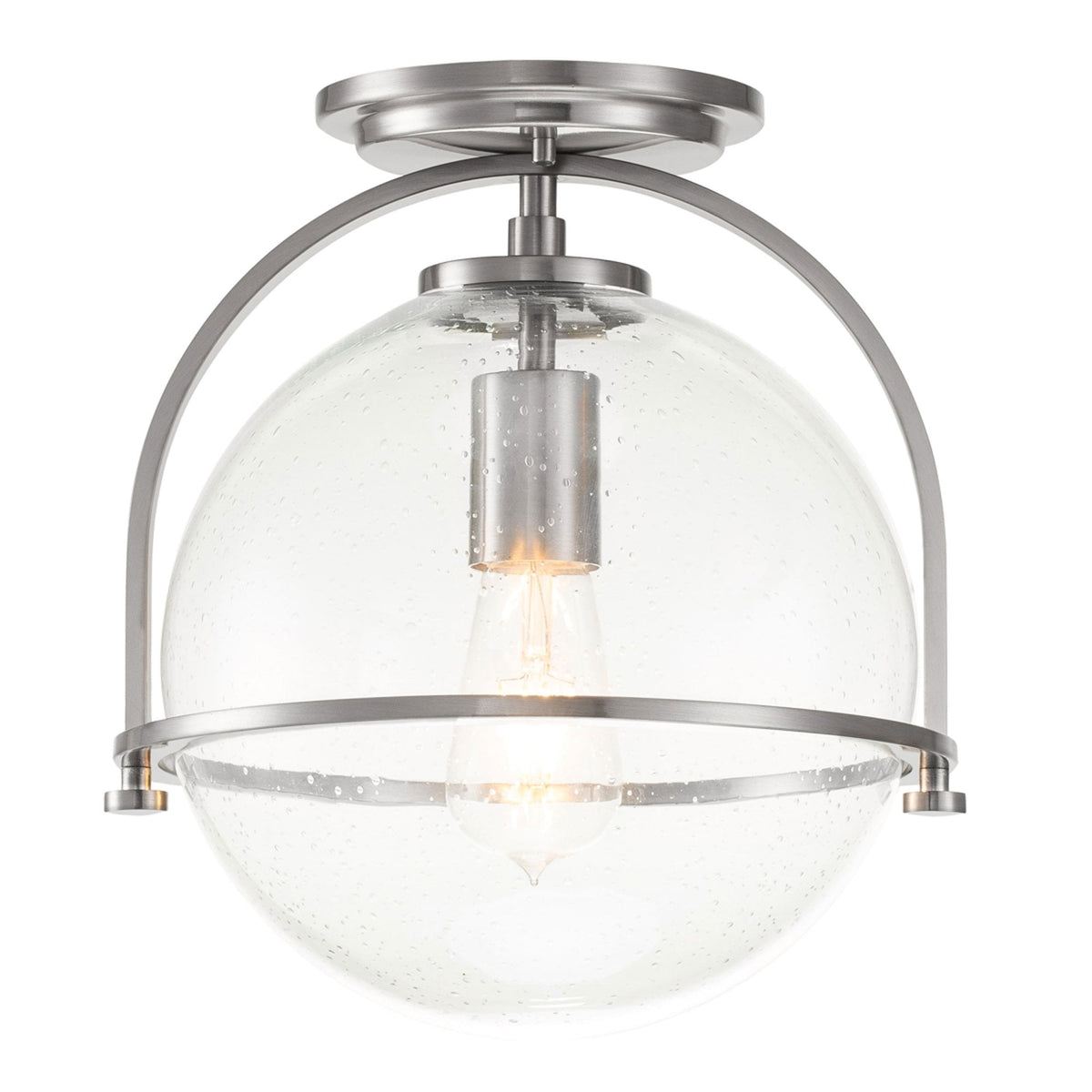 A close-up of a glass light fixture with a metal frame. The light illuminates a room.