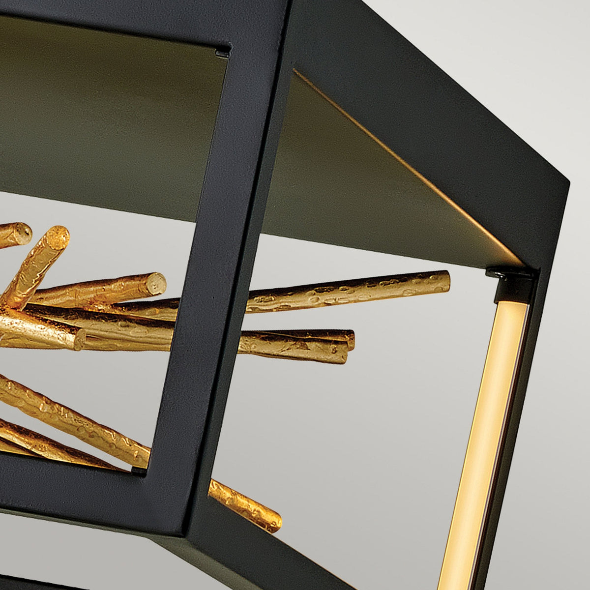 Angled view of the ceiling light highlighting the black frame and gold accents.