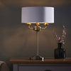Highclere Three Light Table Lamp in Antique Brass with Vintage White Shade