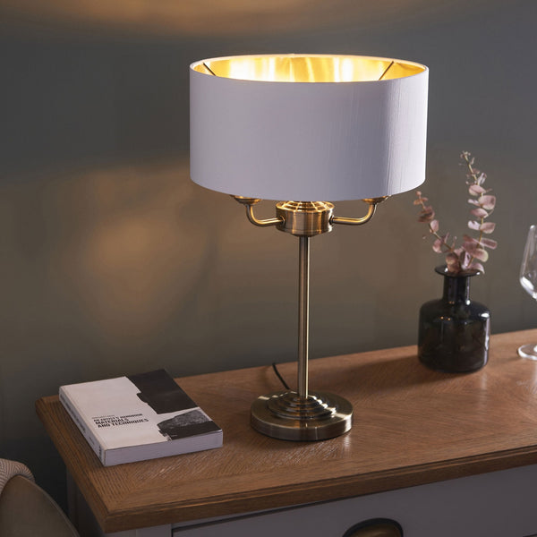 Highclere Three Light Table Lamp in Antique Brass with Vintage White Shade