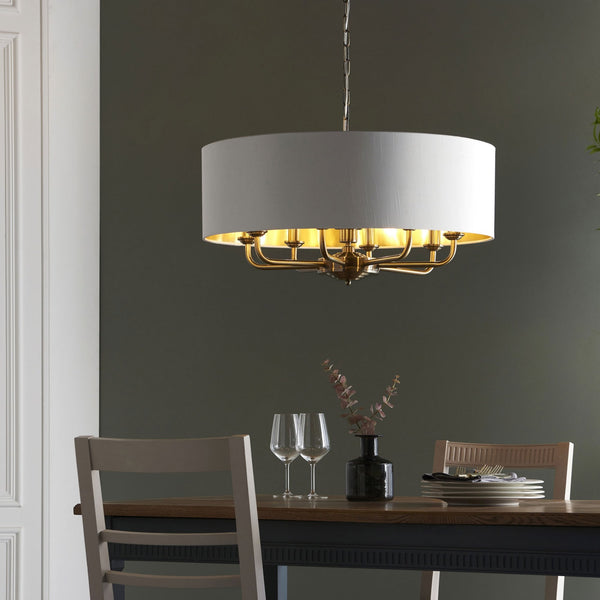 Highclere Eight Light Pendant in Antique Brass with Vintage White Shade