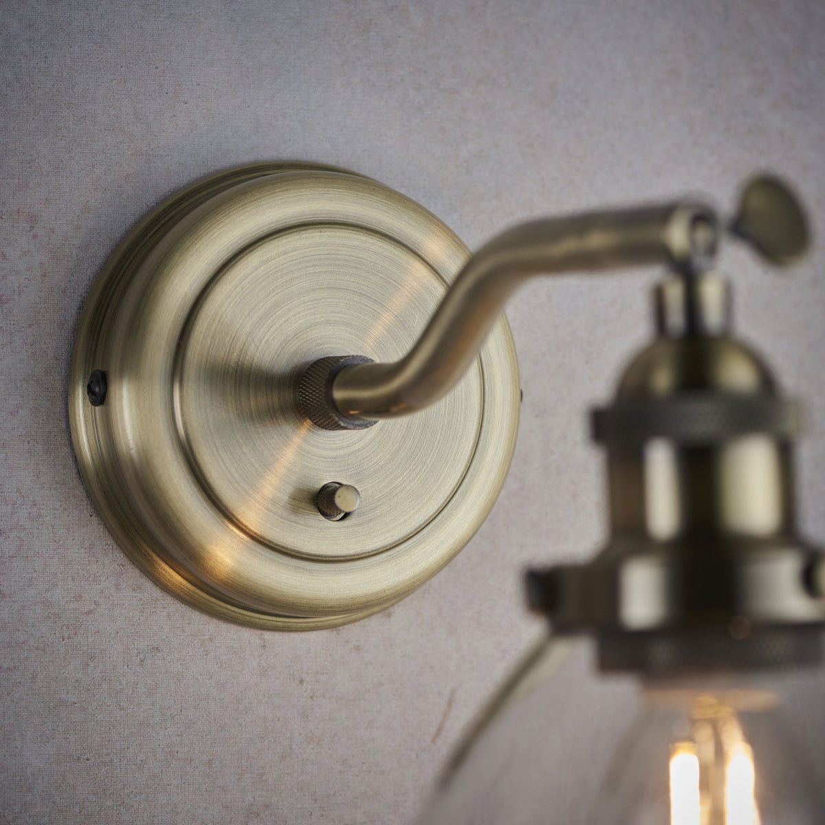 Hansen Wall Light in Antique Brass and Clear Glass Shade