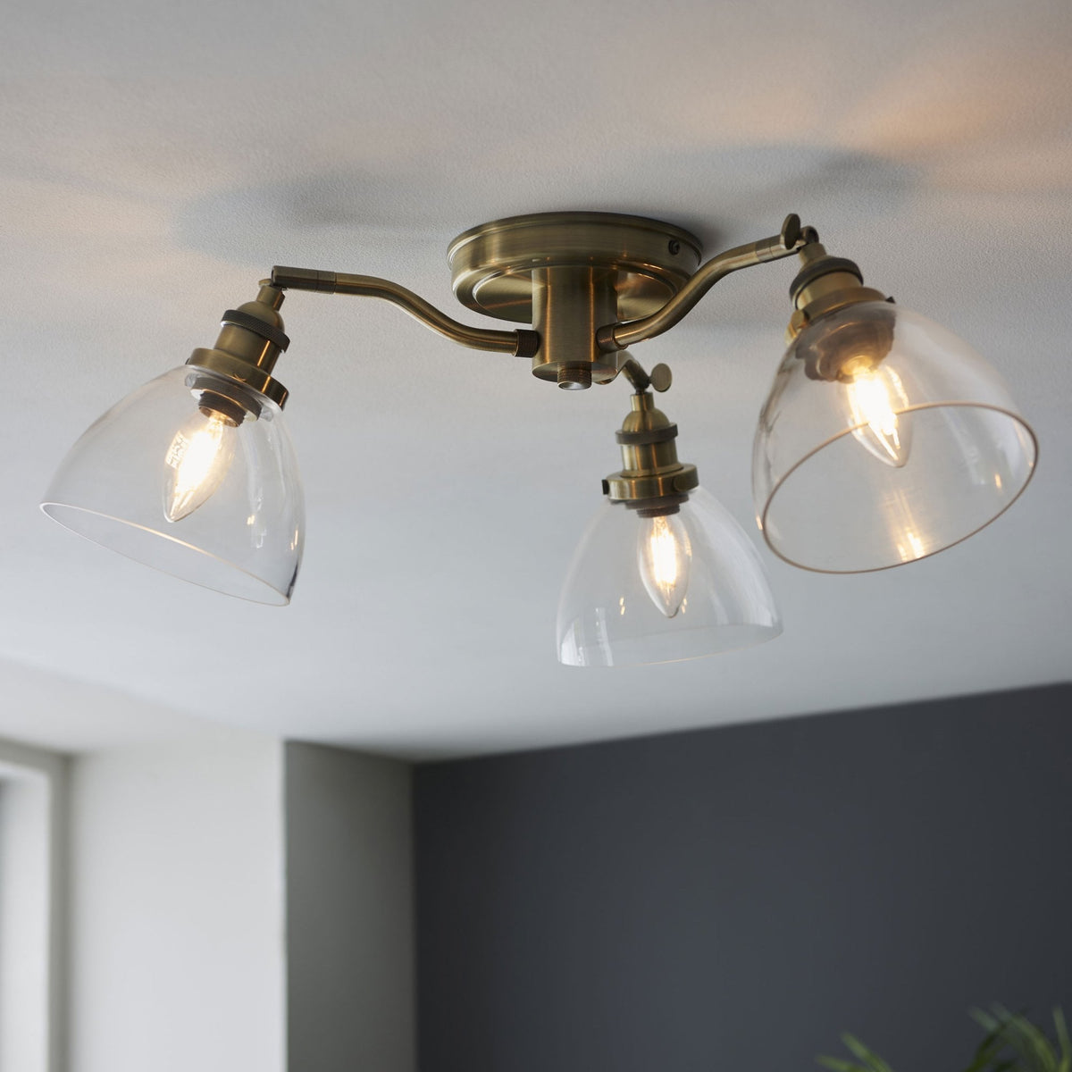 Hansen Three Arm Semi Flush Light in Antique Brass and Clear Glass Shades