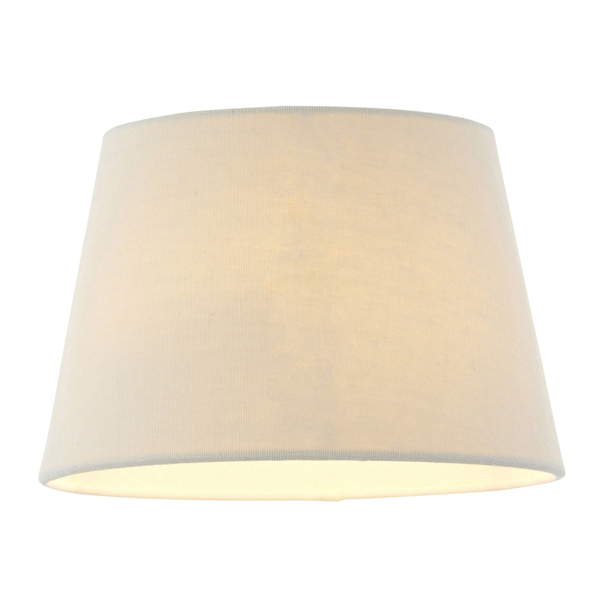 Tapered drum lampshade in natural linen, illuminated from within.
