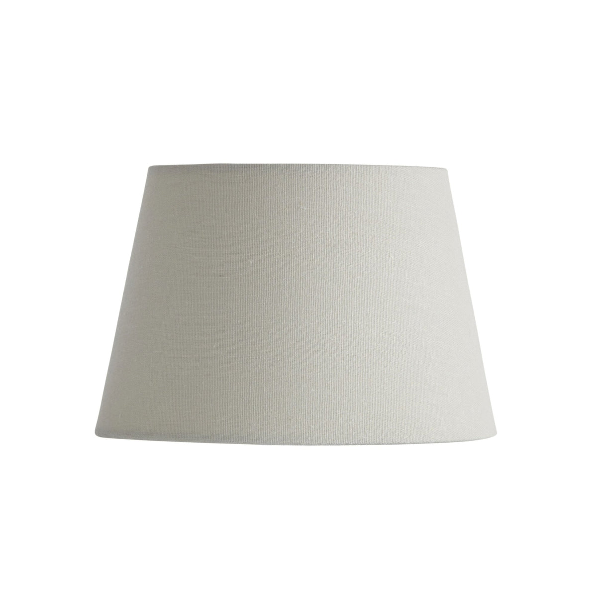 Tapered drum lampshade in natural linen, unlit.