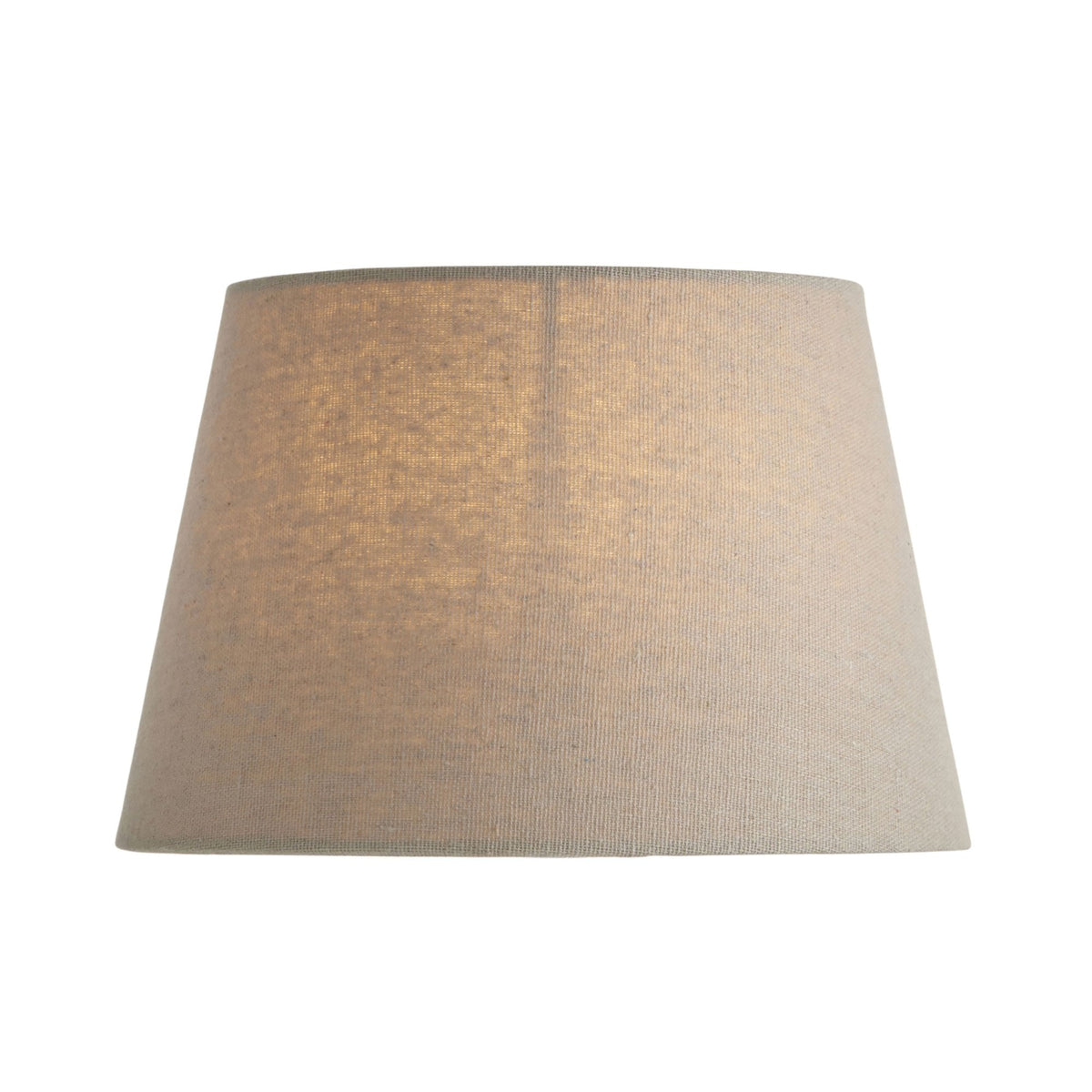 Tapered drum lampshade in natural linen, with subtle light filtering through the fabric.