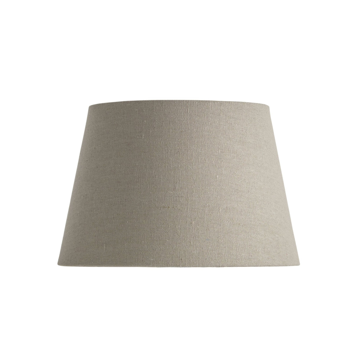 Tapered drum lampshade in natural linen, unlit, showcasing its neutral color and texture.