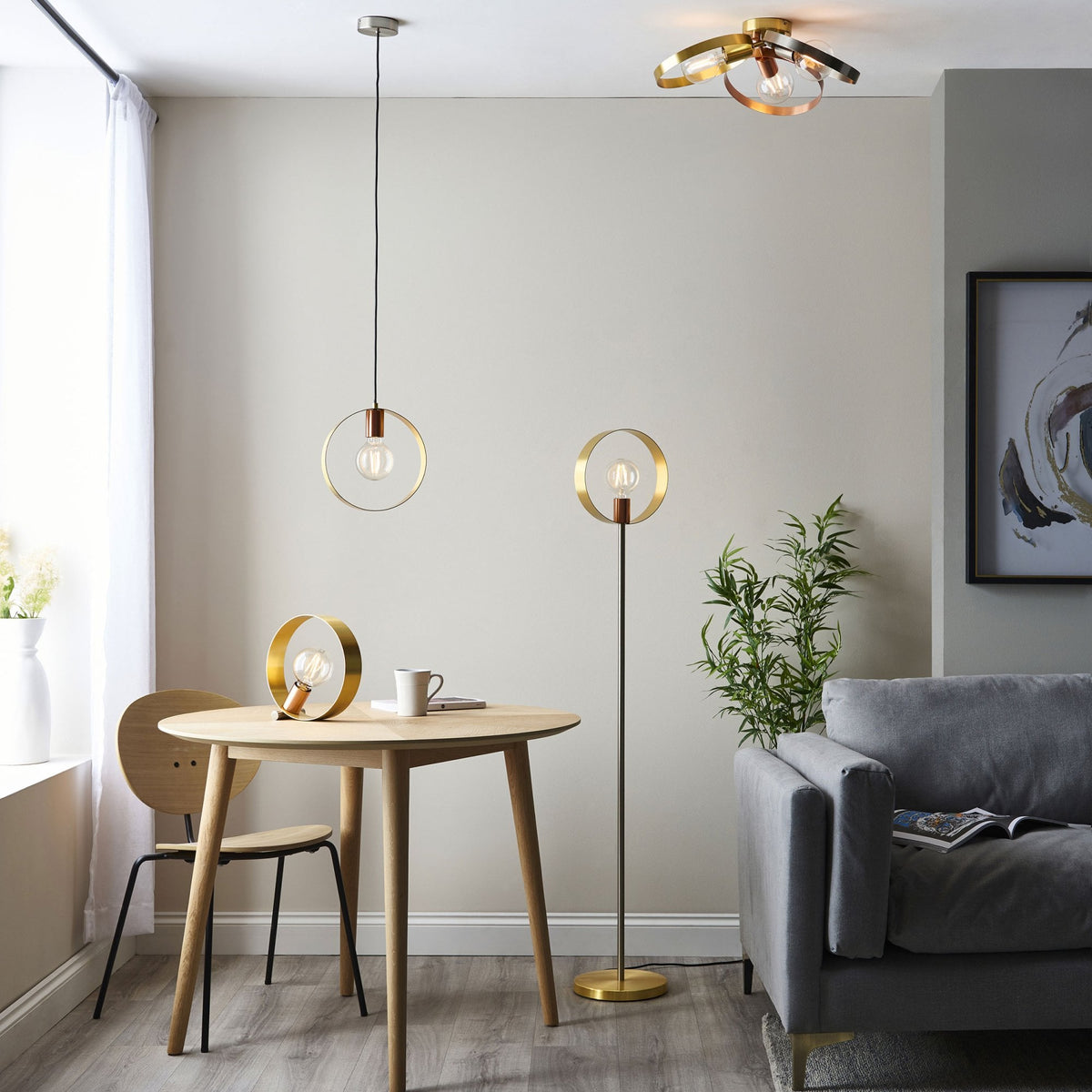 A living space featuring the pendant light, a matching floor lamp, and a ceiling light in a cohesive style.