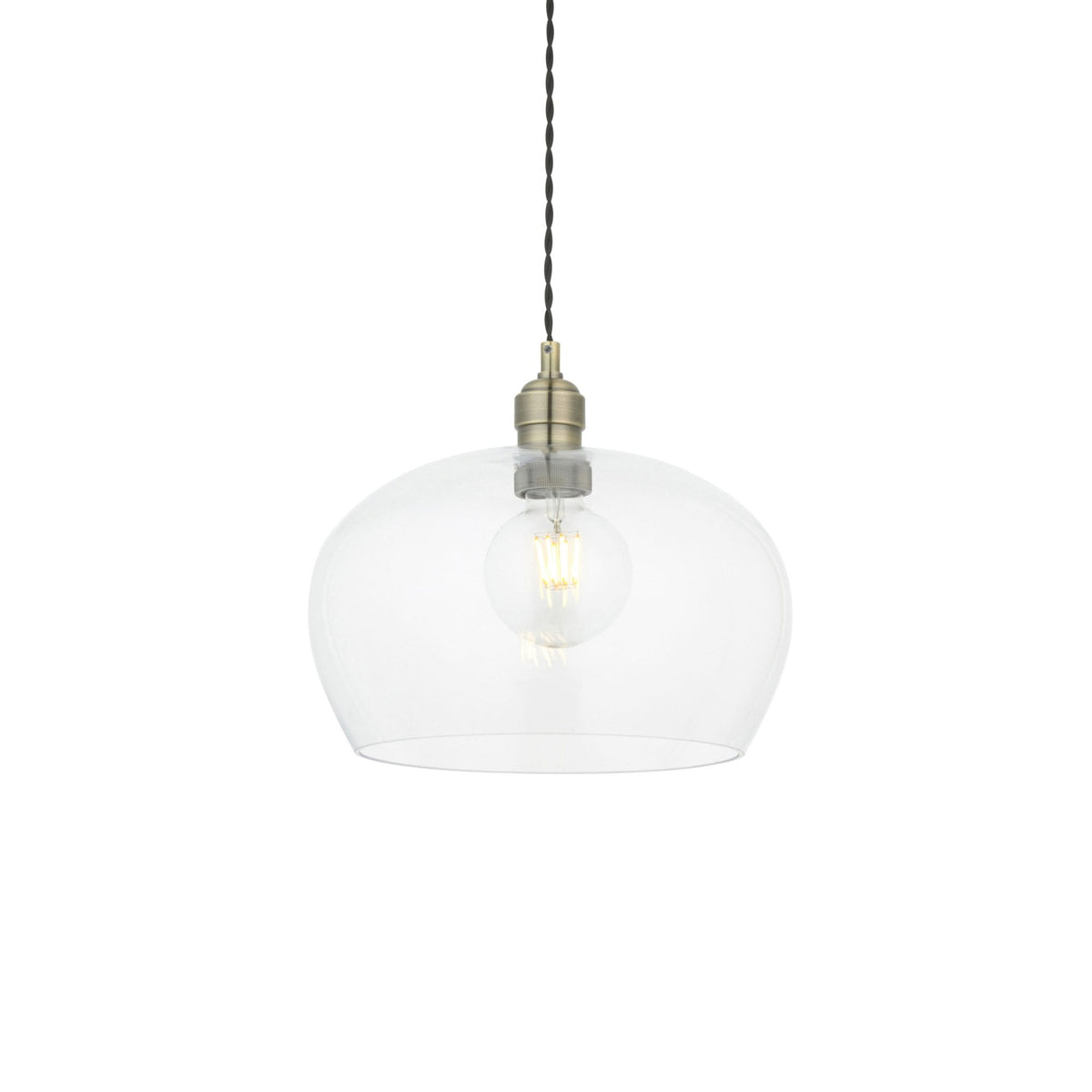 A clear glass pendant light with a vintage-style bulb, suspended by a twisted fabric cable against a white background.
