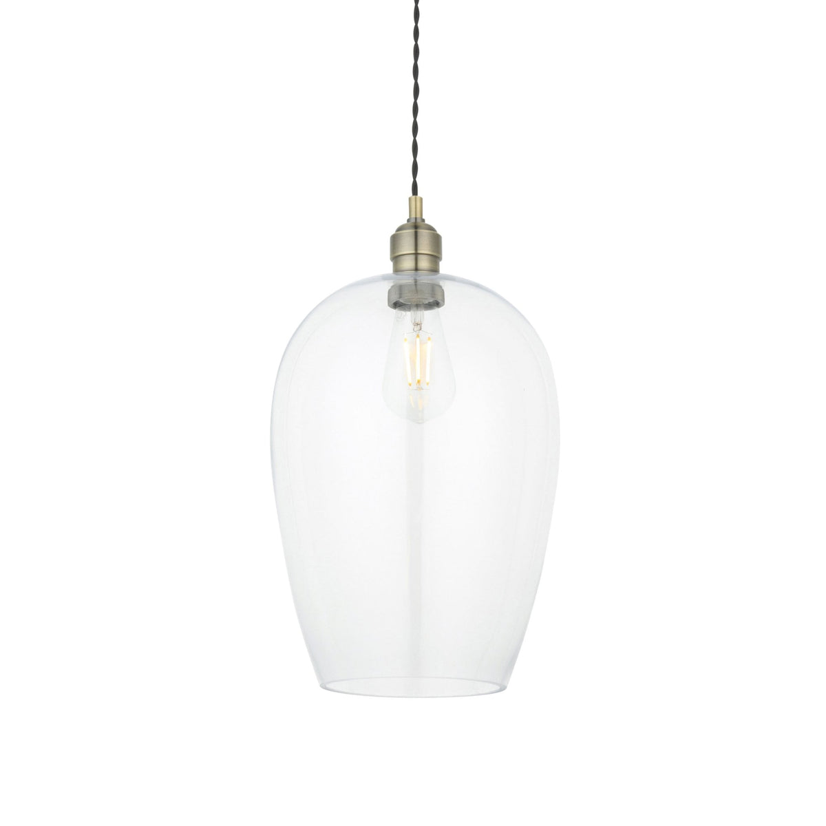 A clear glass pendant light with an Edison bulb and brass fitting on a white background.