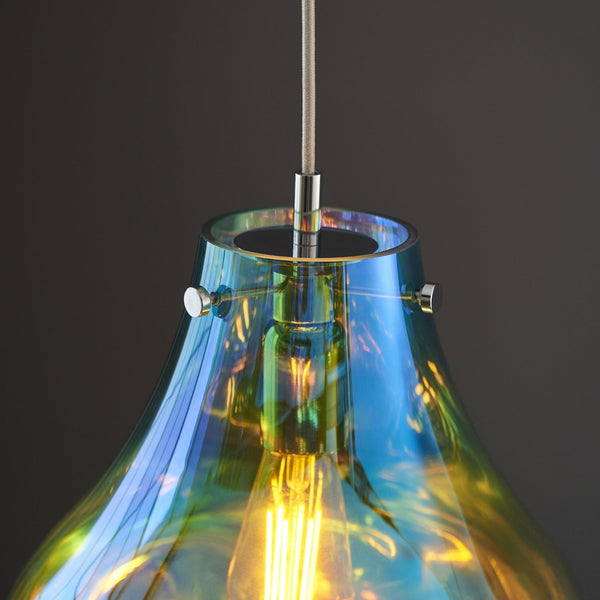 Close-up of the iridescent glass pendant light, showing the top fixture and bulb.