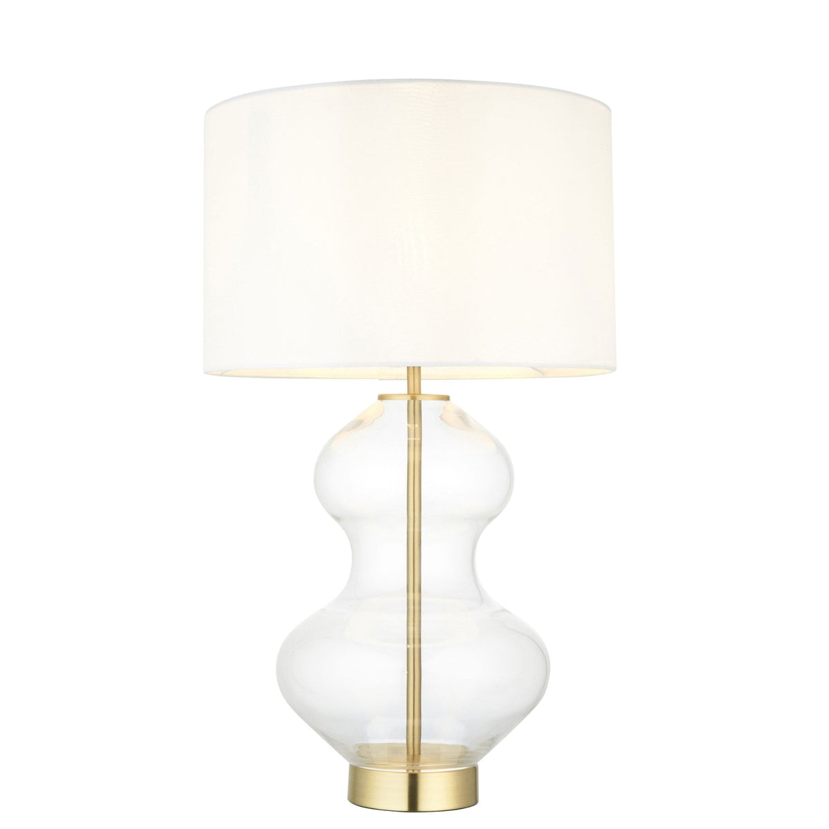 A glass table lamp with a brass base and a white shade, unlit, on a white background.