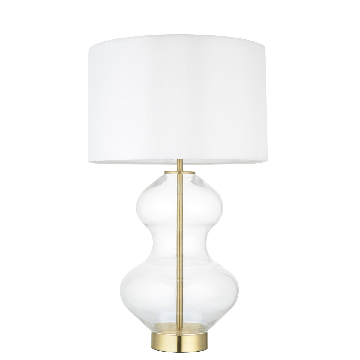 A glass table lamp with a brass base and a white shade, lit, on a white background.