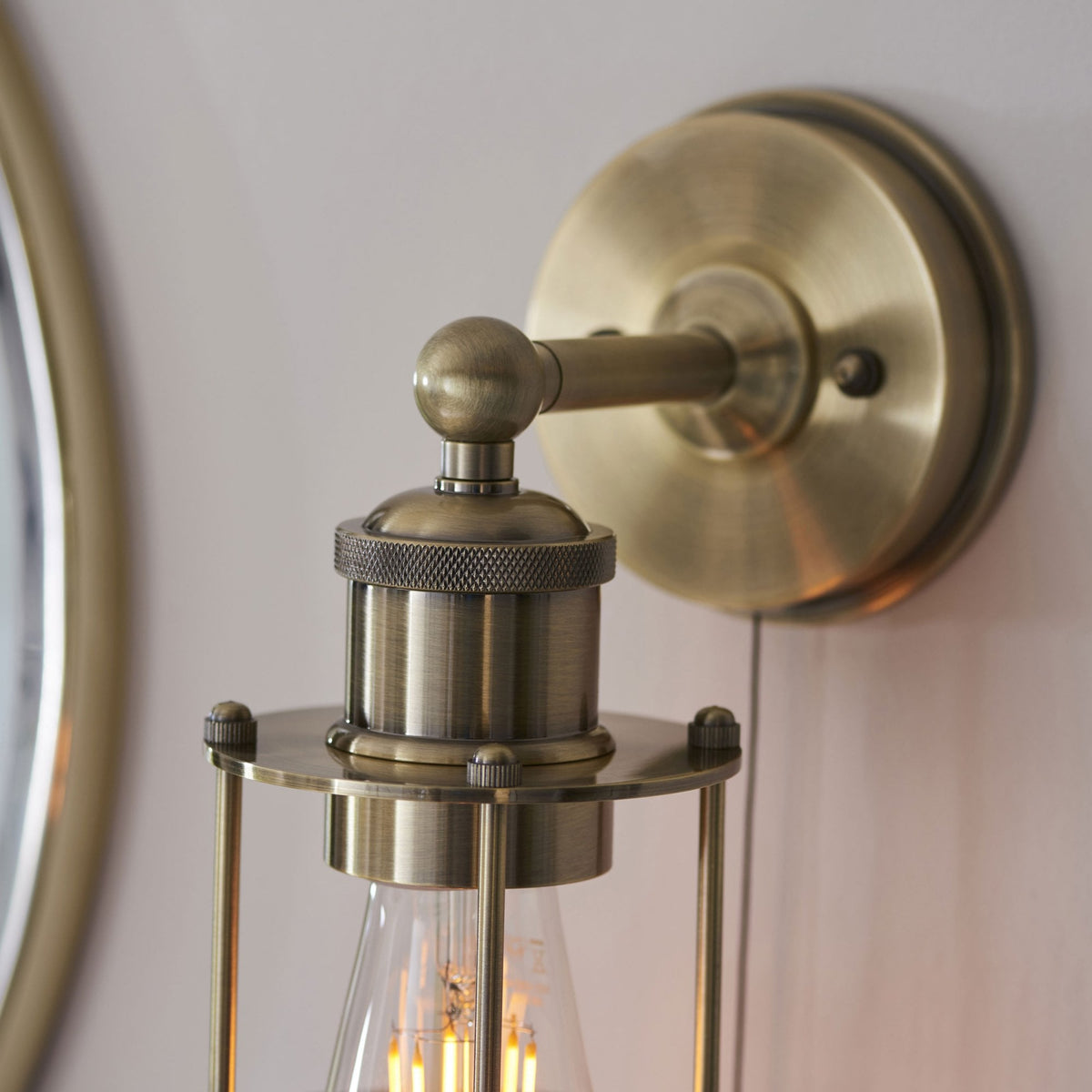 Crew Caged IP44 Switched Wall Light in Antique Brass