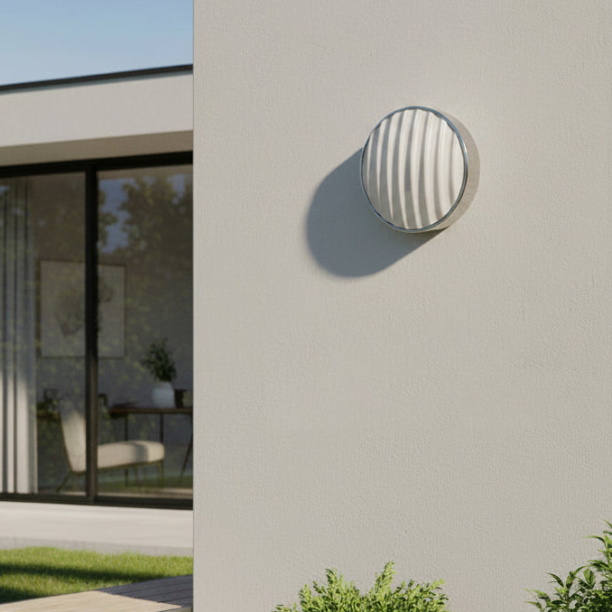 Astro Montreal Round 300 IP44 Exterior Wall Light in Brushed Stainless Steel on an outdoor wall