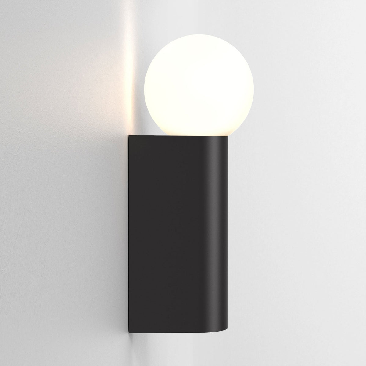 Black wall sconce with a spherical white light bulb