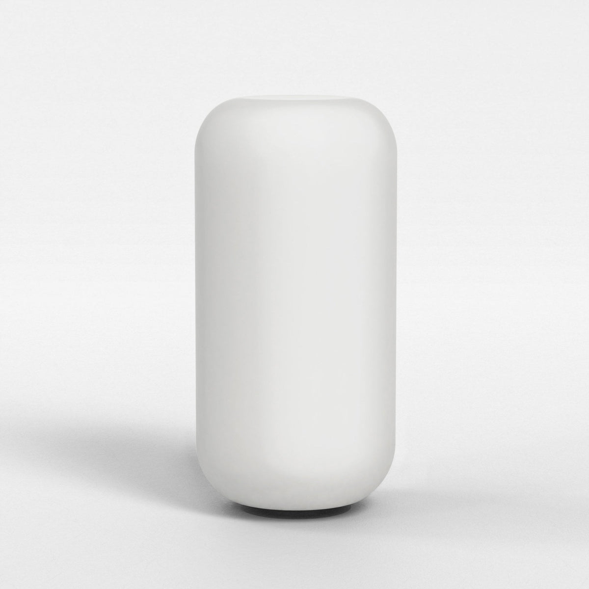 White cylindrical vase with rounded top and bottom