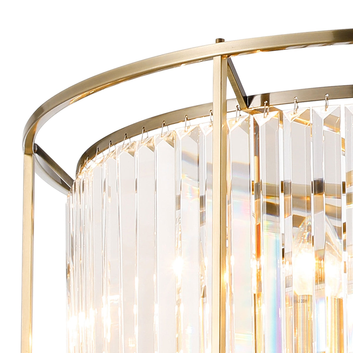 Close-up of a gold chandelier with rectangular crystal prisms, reflecting light.