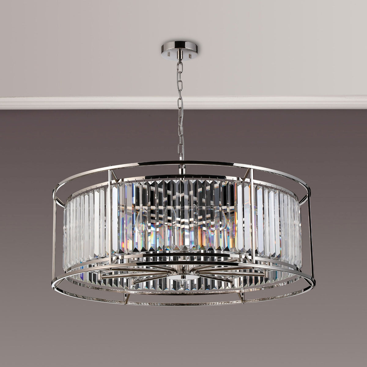 Round crystal chandelier with a polished chrome frame and hanging crystals.
