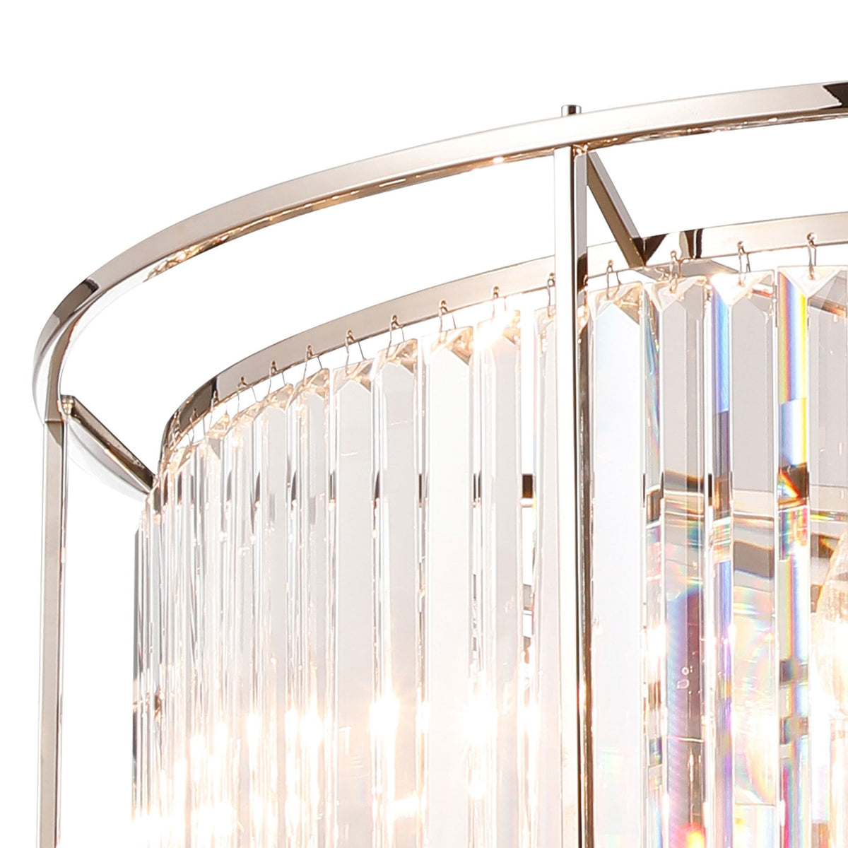Close-up of a modern chandelier with rectangular crystal prisms hanging from a polished chrome frame.