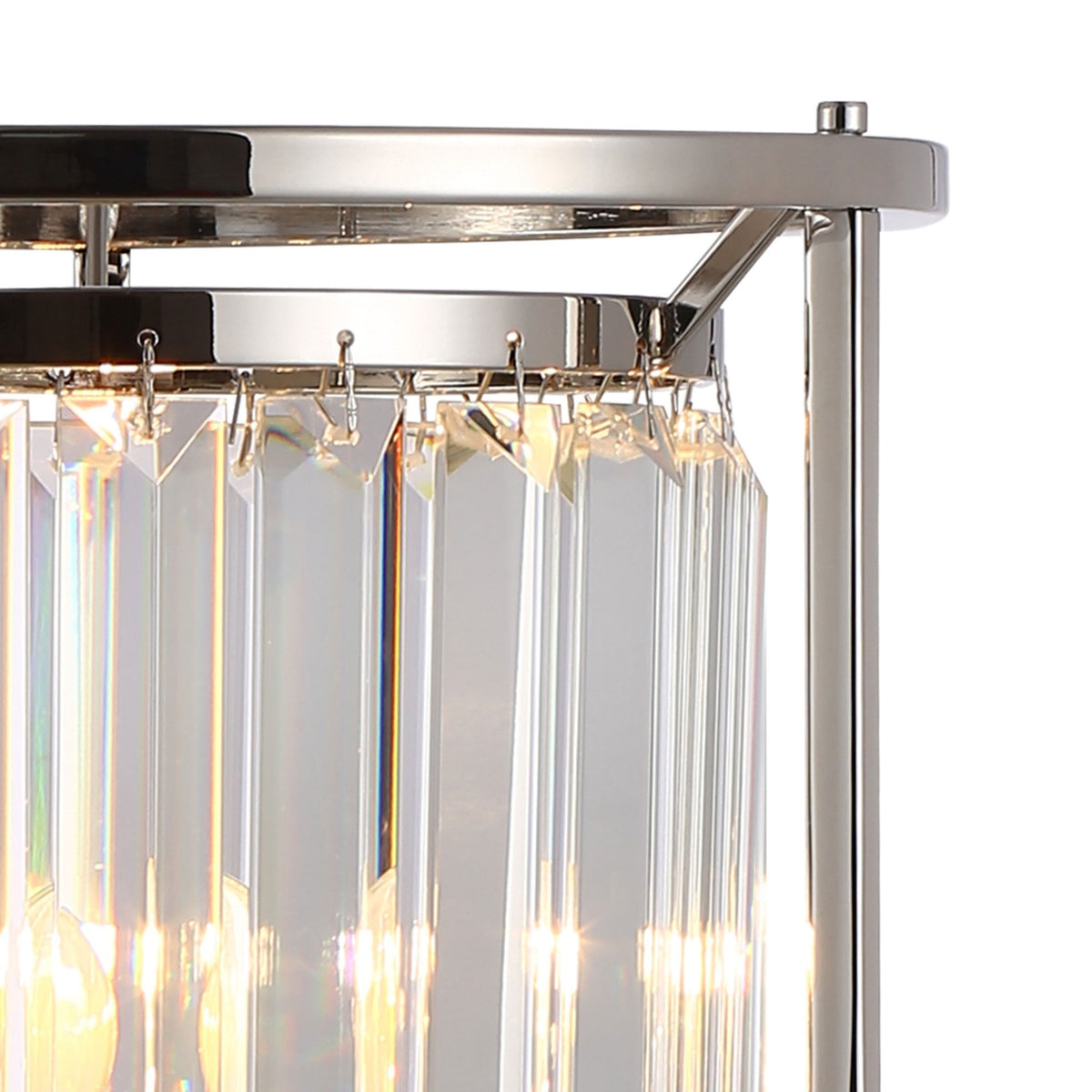 Close up of a crystal chandelier with light reflecting off the crystals