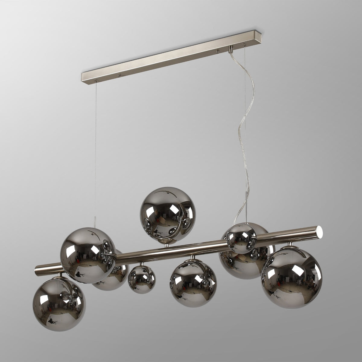 A modern chandelier with a rectangular ceiling mount and a horizontal bar holding eight reflective spherical lights