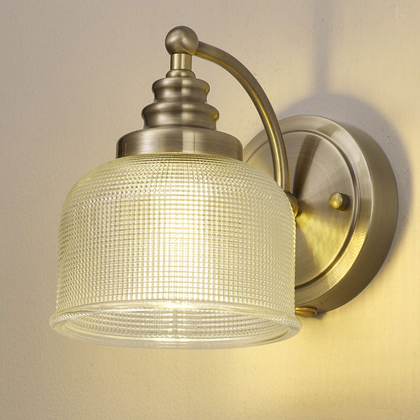 Stowford Switched Single Wall Light in Antique Brass & Clear Prismatic Glass