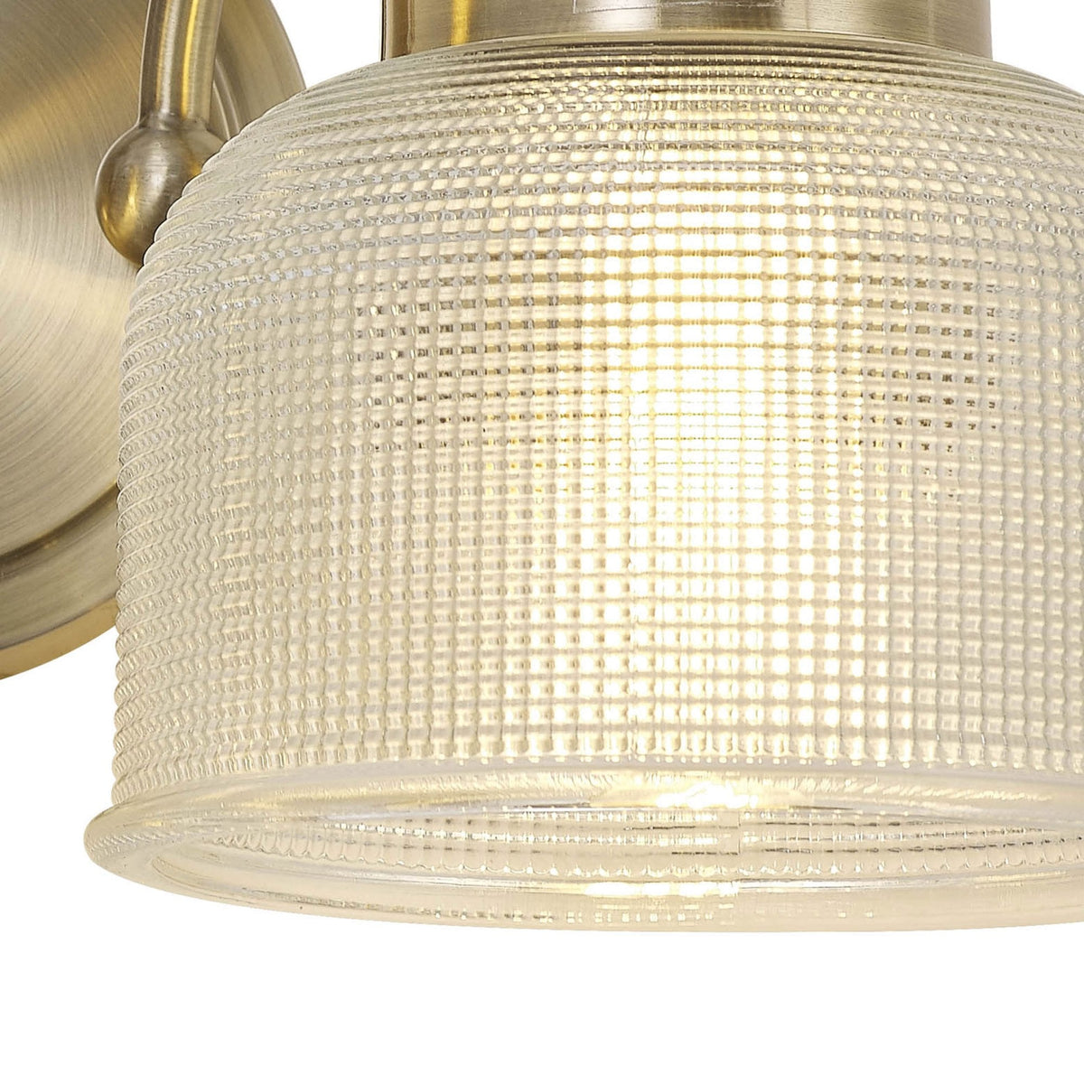 Stowford Switched Twin Wall Light in Antique Brass & Clear Prismatic Glass