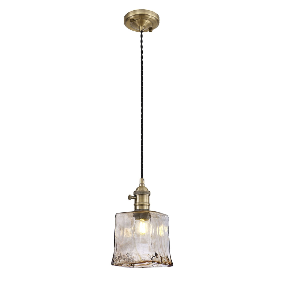 A single pendant light with a clear, textured glass shade and an antique brass finish
