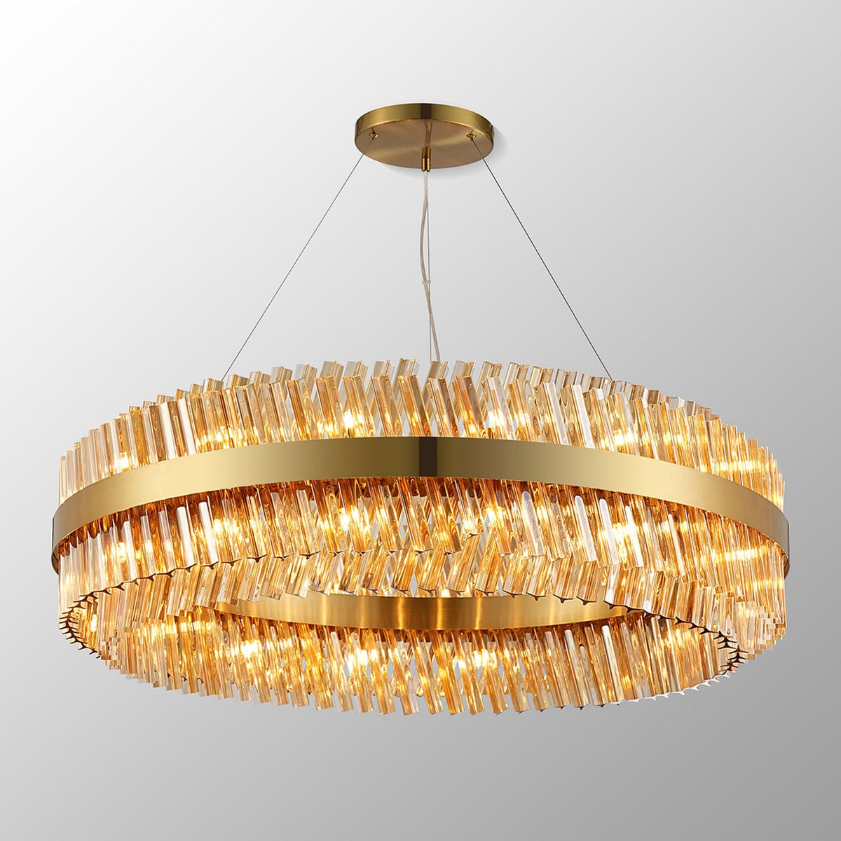 Kelly Thirty Two Light Pendant in Brass & Amber Glass