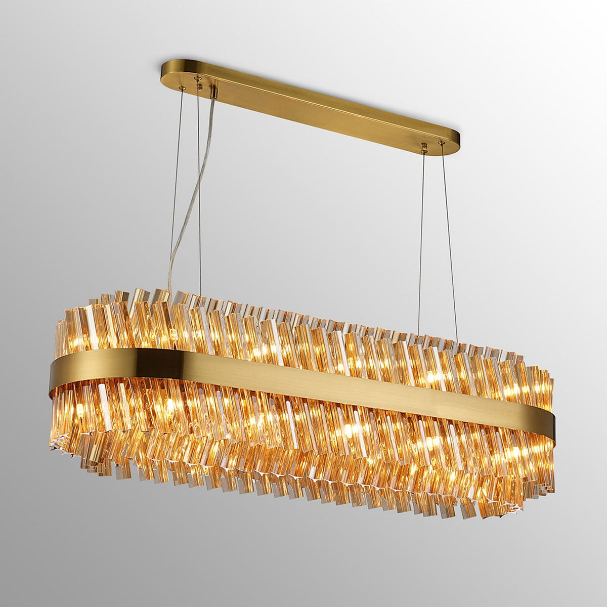 Kelly Twenty Four Light Oblong Pendant in Brass & Amber Glass