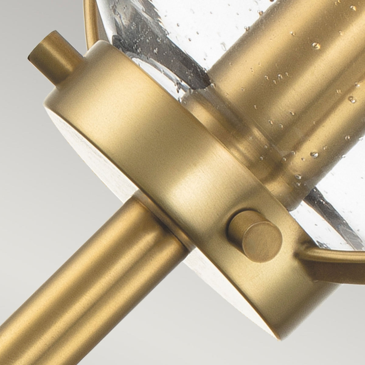 Hollis IP44 Single Wall Light in Heritage Brass with Clear Seeded Glass