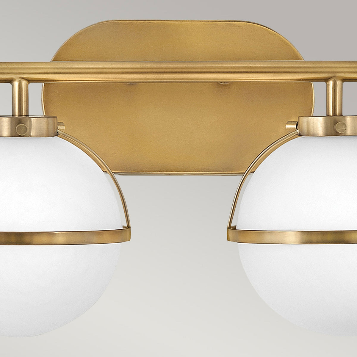 Hollis IP44 Twin Wall Light in Heritage Brass with Opal Glass