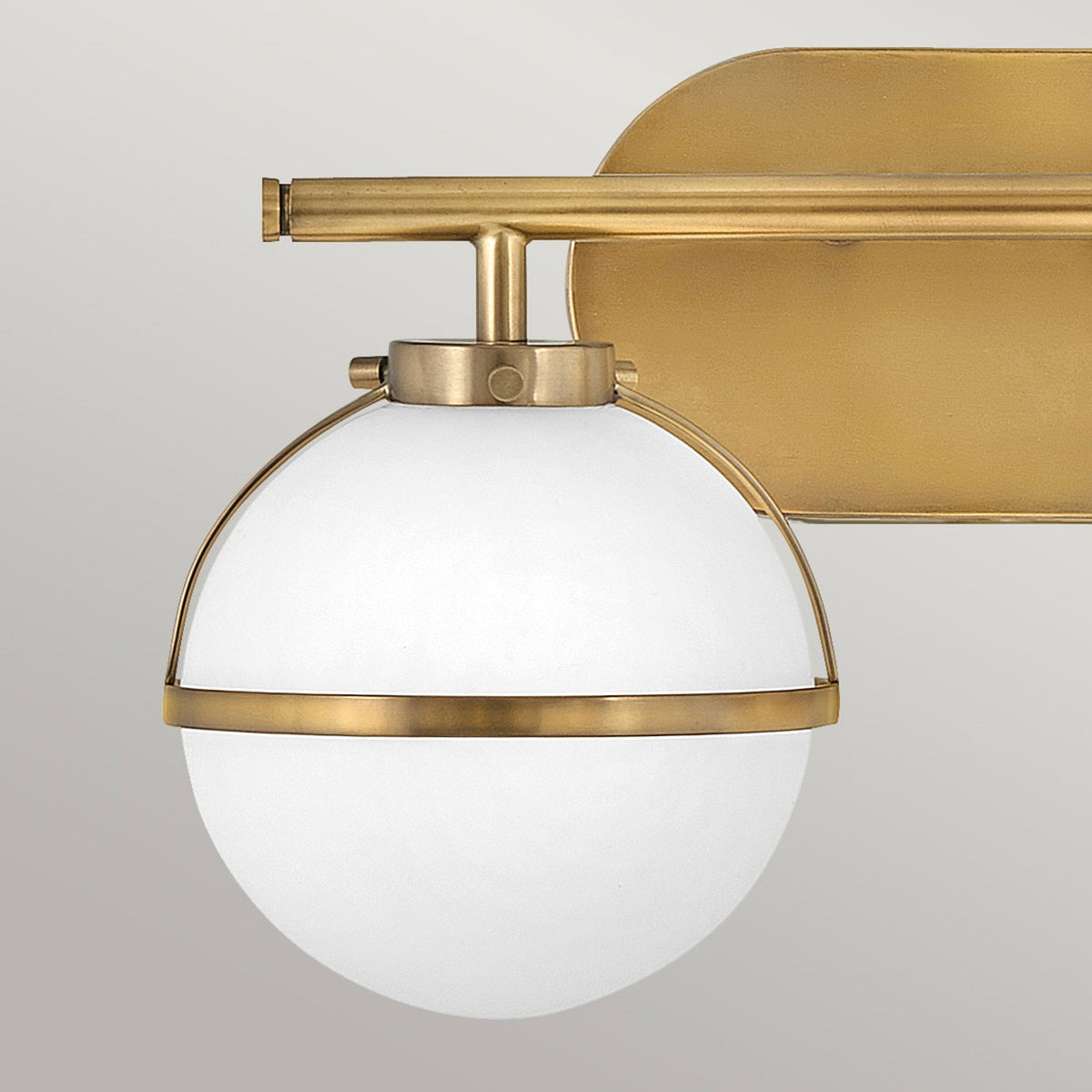 Hollis IP44 Twin Wall Light in Heritage Brass with Opal Glass