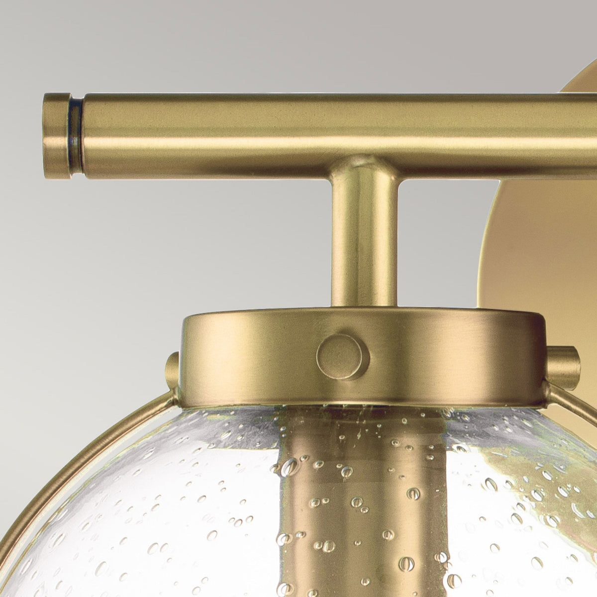 Hollis IP44 Twin Wall Light in Heritage Brass with Clear Seeded Glass