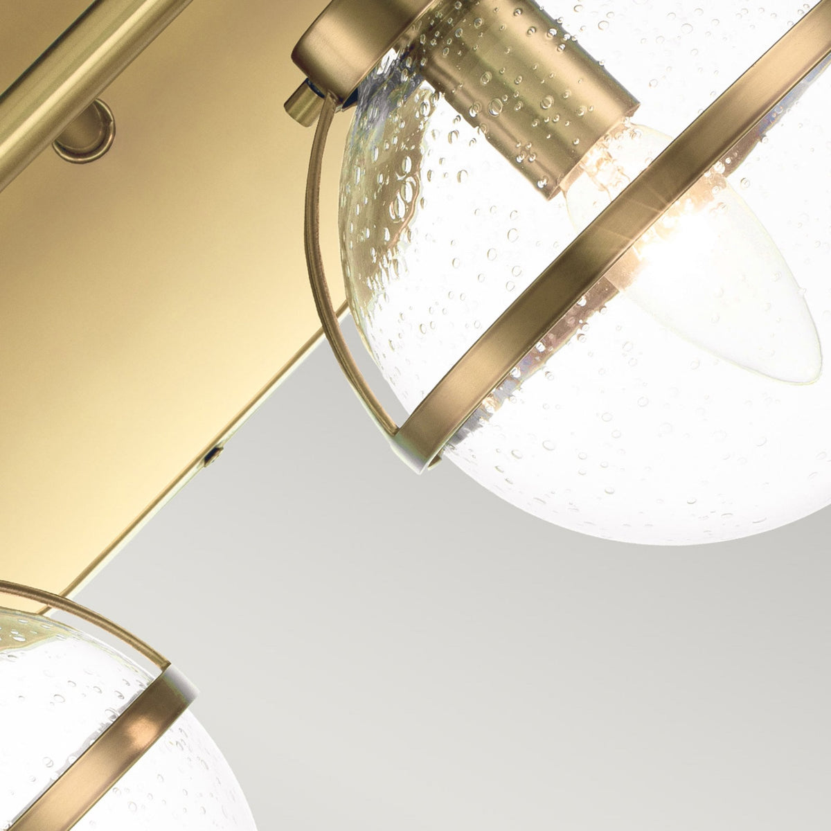 Hollis IP44 Twin Wall Light in Heritage Brass with Clear Seeded Glass