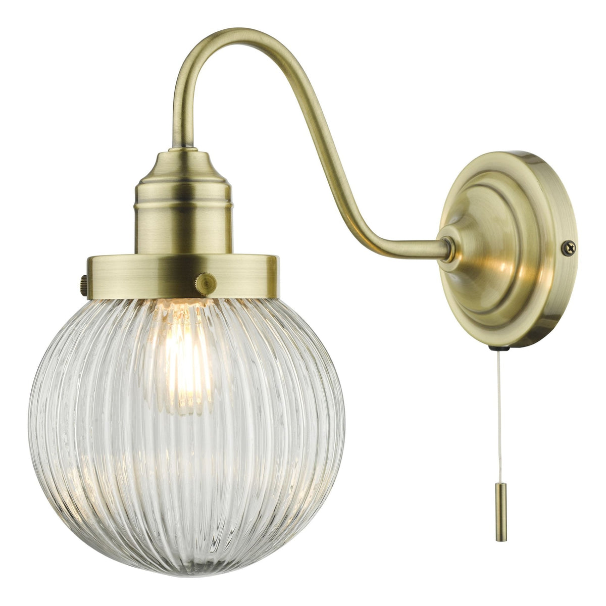 Antique brass wall light with a curved arm, ribbed glass globe shade, and a pull cord switch.