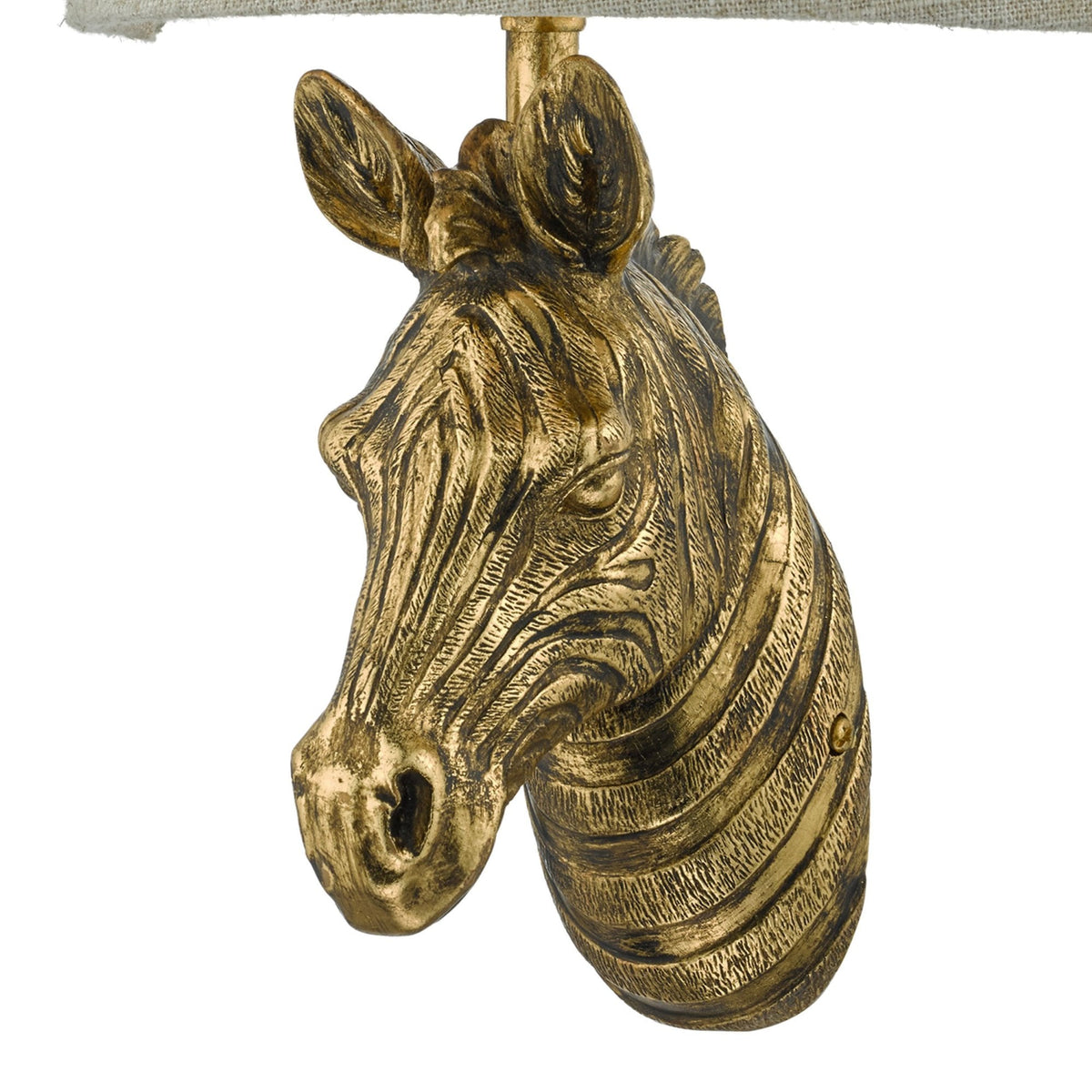 Golden zebra head with textured stripes, part of a lamp base, on a white background.