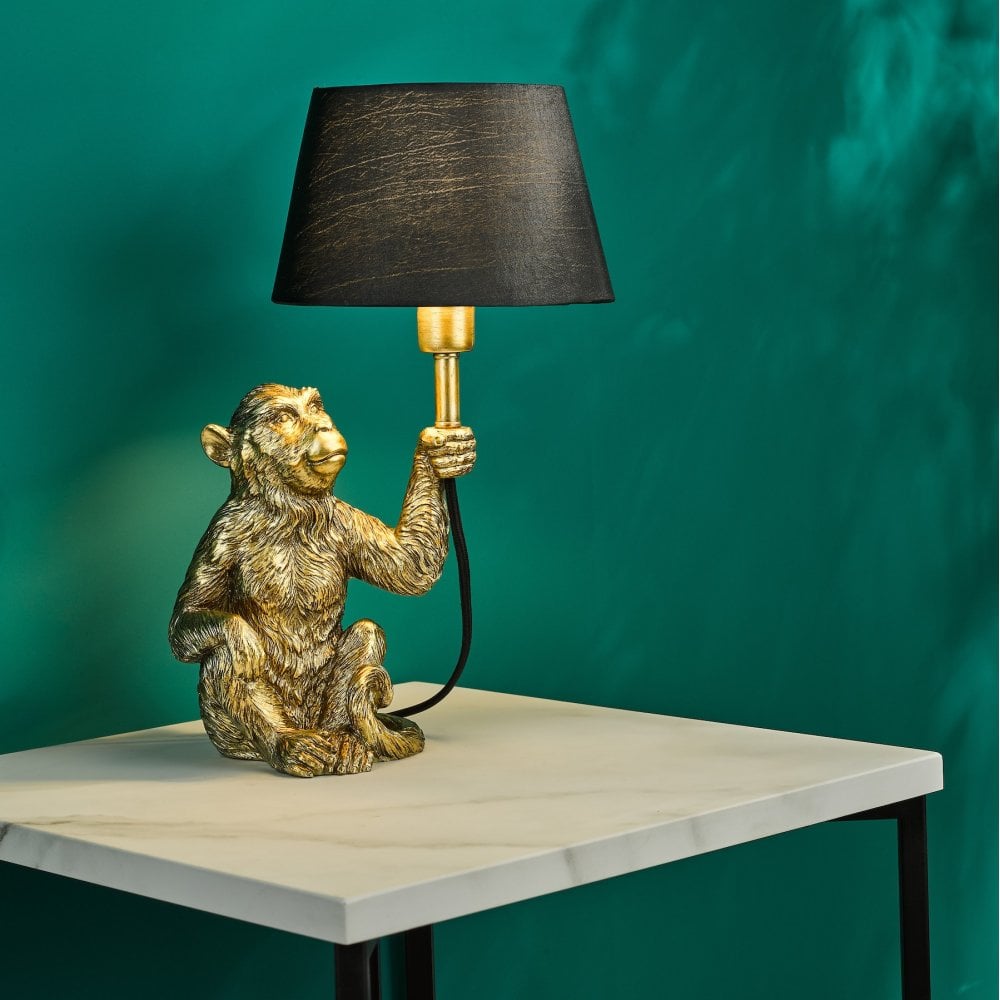 Zira Monkey Table Lamp In Gold With Black Faux Silk Shade